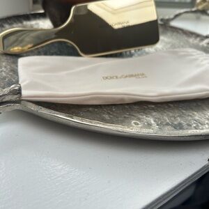Dolce &  and Gabbana gold chrome paddle hairbrush with dust bag